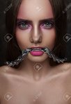 55577845-fashion-beauty-girl-with-chain-in-her-mouth-and-shiny-perfect-skin.jpg